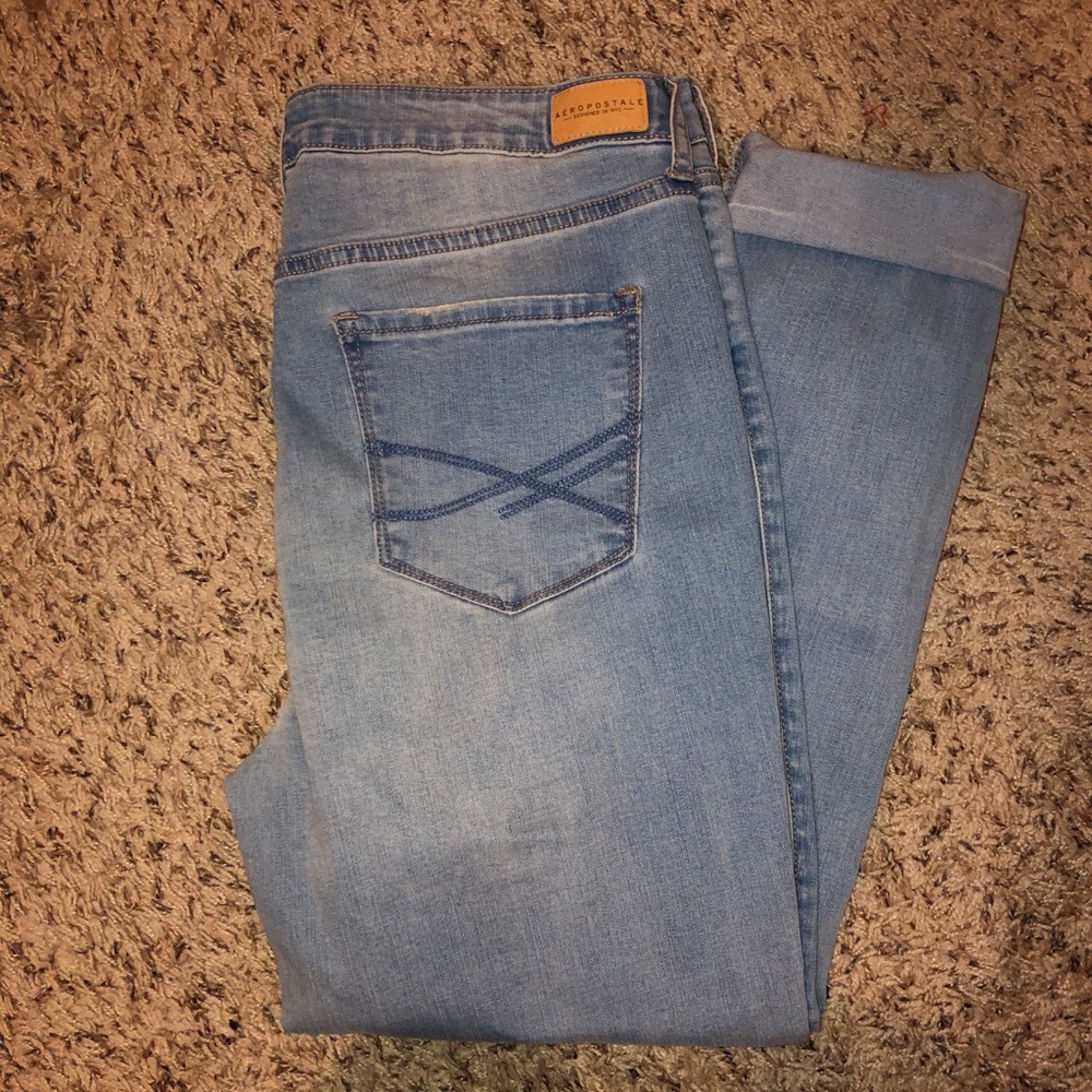 light wash jeans with rip in knee